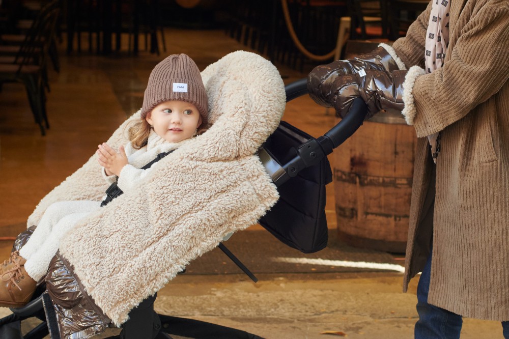 A baby being pushed in a pram