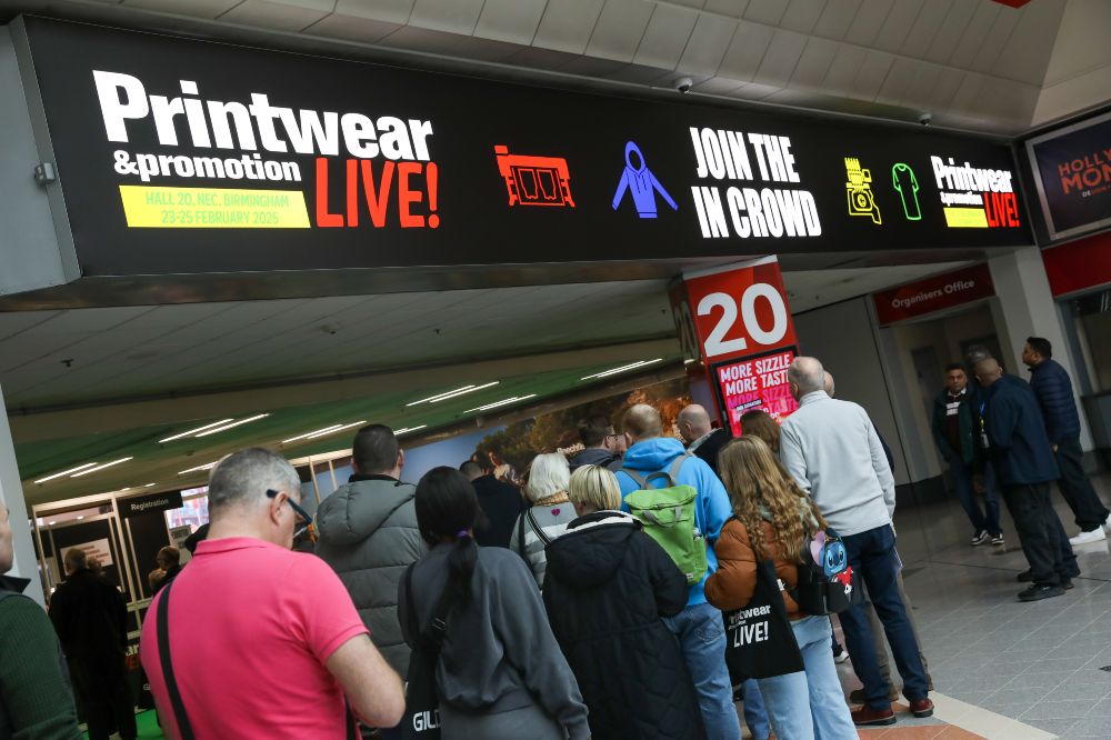 A queue of people outside the entrance of Printwear & Promotion LIVE!