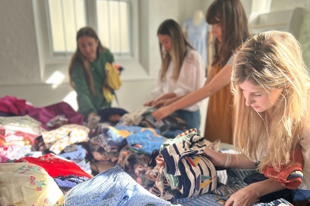 The JoJo Maman Bebe team sorting samples for Action for Children