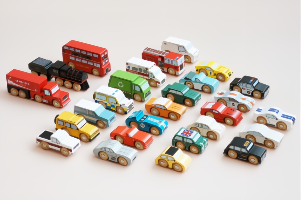 A display of wooden classic car toys by Le Toy Van