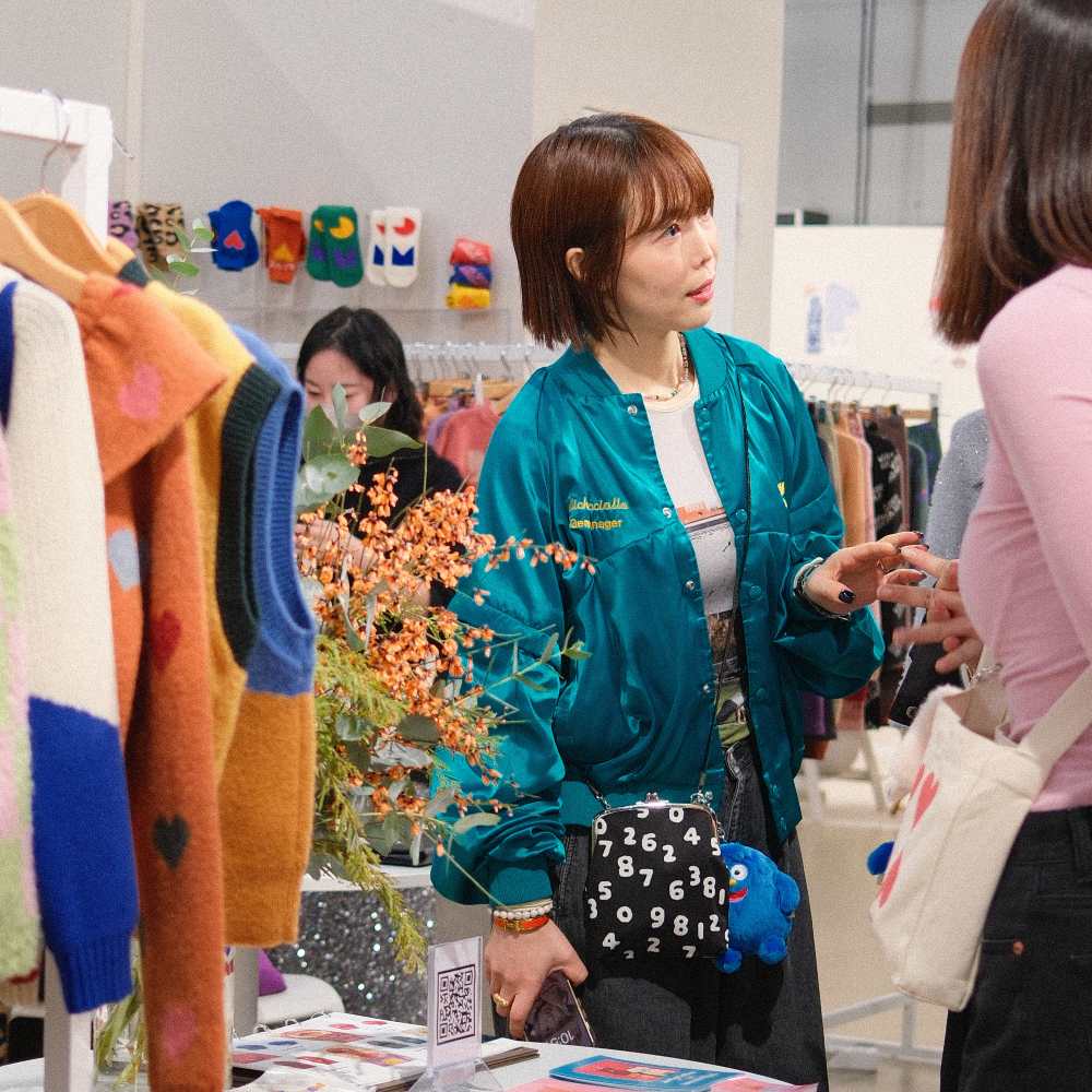 People on a childrenswear stand at the Playtime Paris trade show 