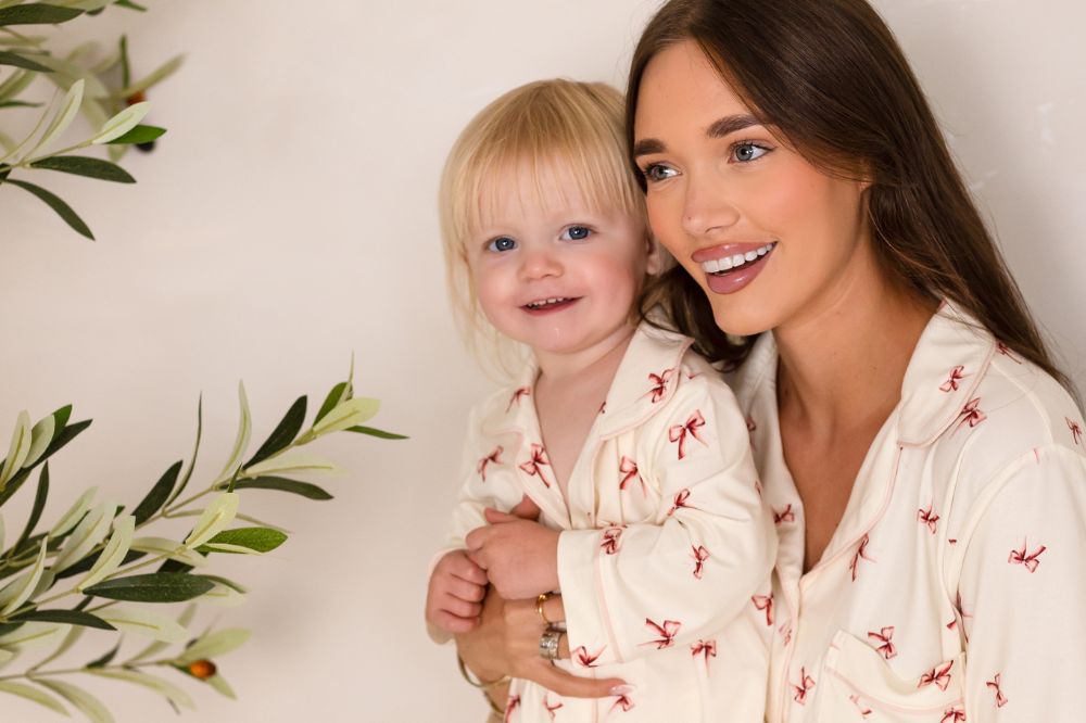 A woman and child in matching Cozy Crew Club pyjamas