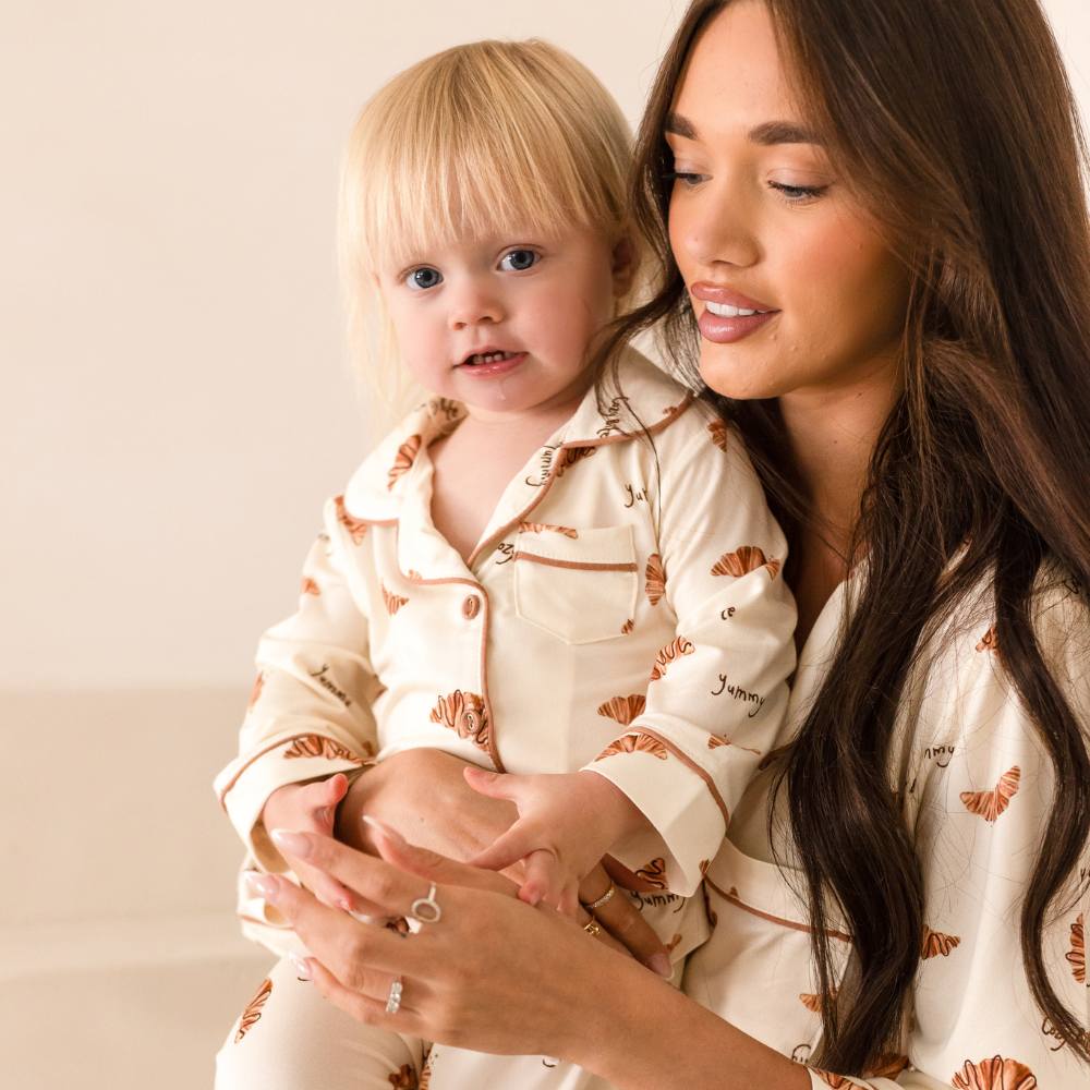 A woman and baby in matching Cozy Crew Club pyjamas