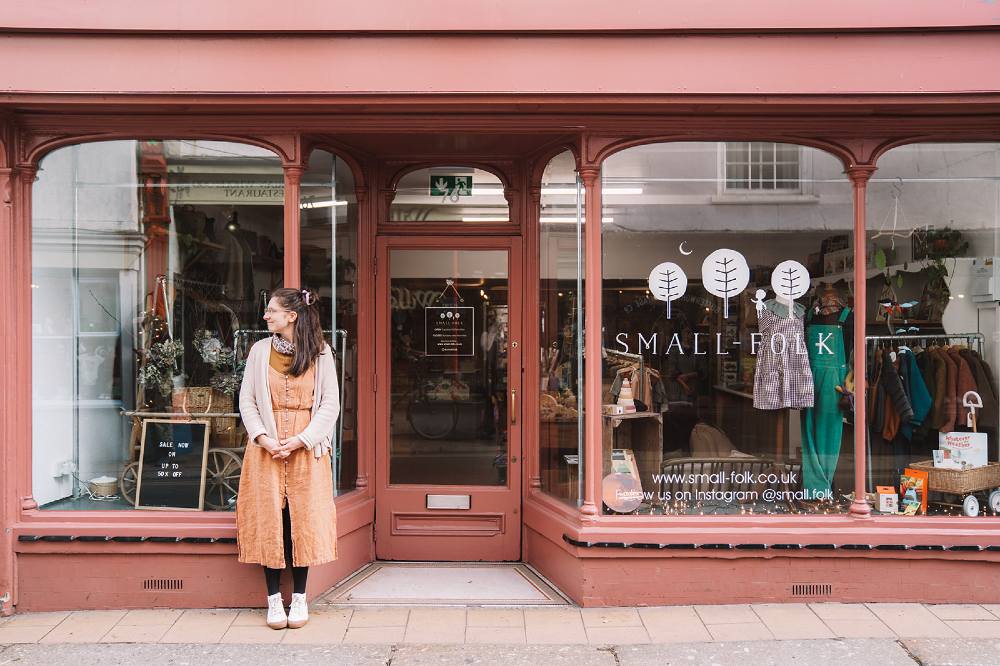 A woman stood outside the SMALL-FOLK store