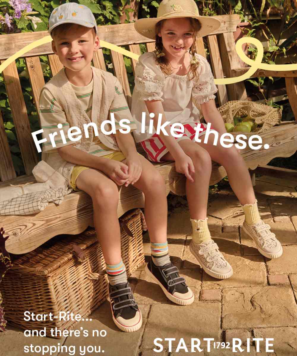 Two children sat on a bench outside wearing summer outfits and Start-Rite shoes 