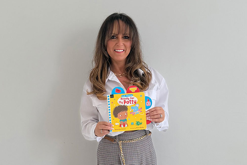 Amanda Jenner holding a copy of Ready for my Potty Book