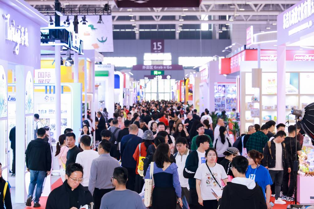 A crowd of people in an exhibition hall 