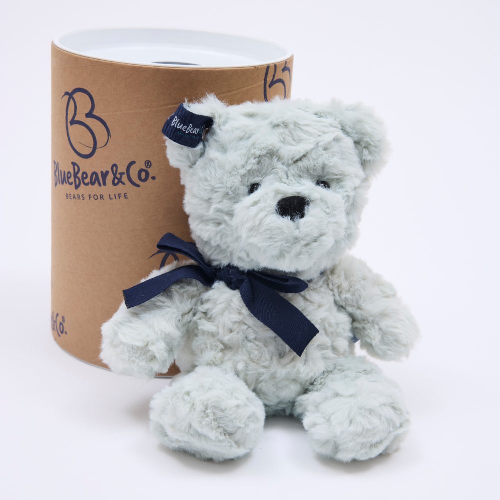 A pale blue bear beside a gift box by Blue Bear & Co. 