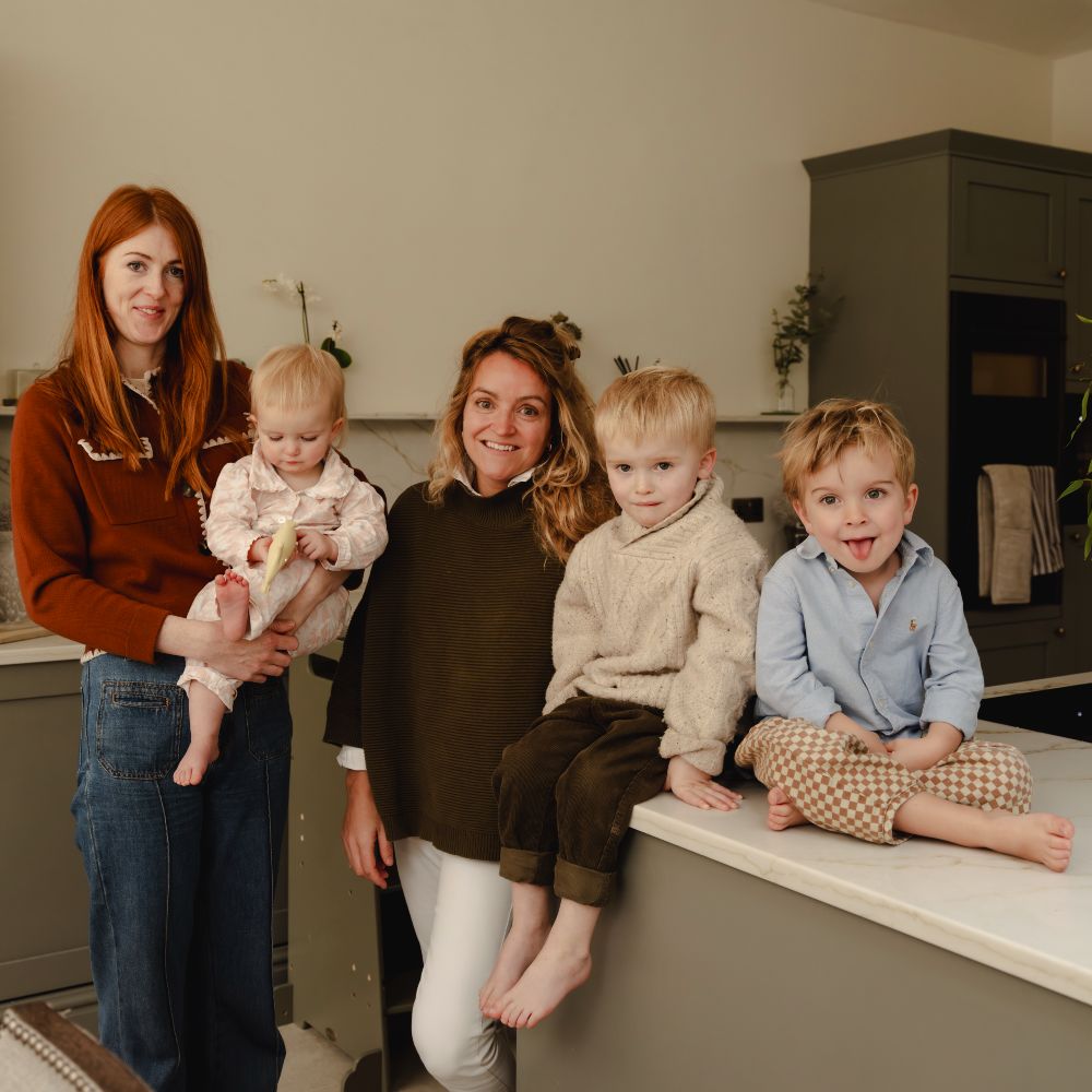 The founders of Little Brushies in a kitchen with their young children