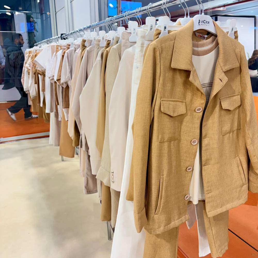 Children's clothes displayed on a stand at IFCO Kids 