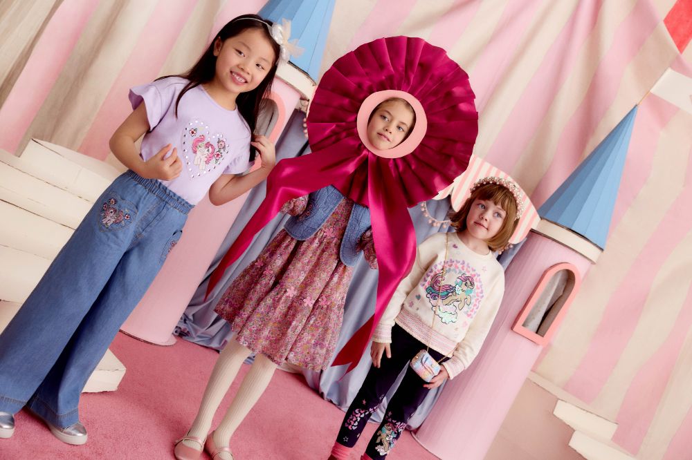 Three girls wearing outfits from the My Little Pony collection by Monsoon