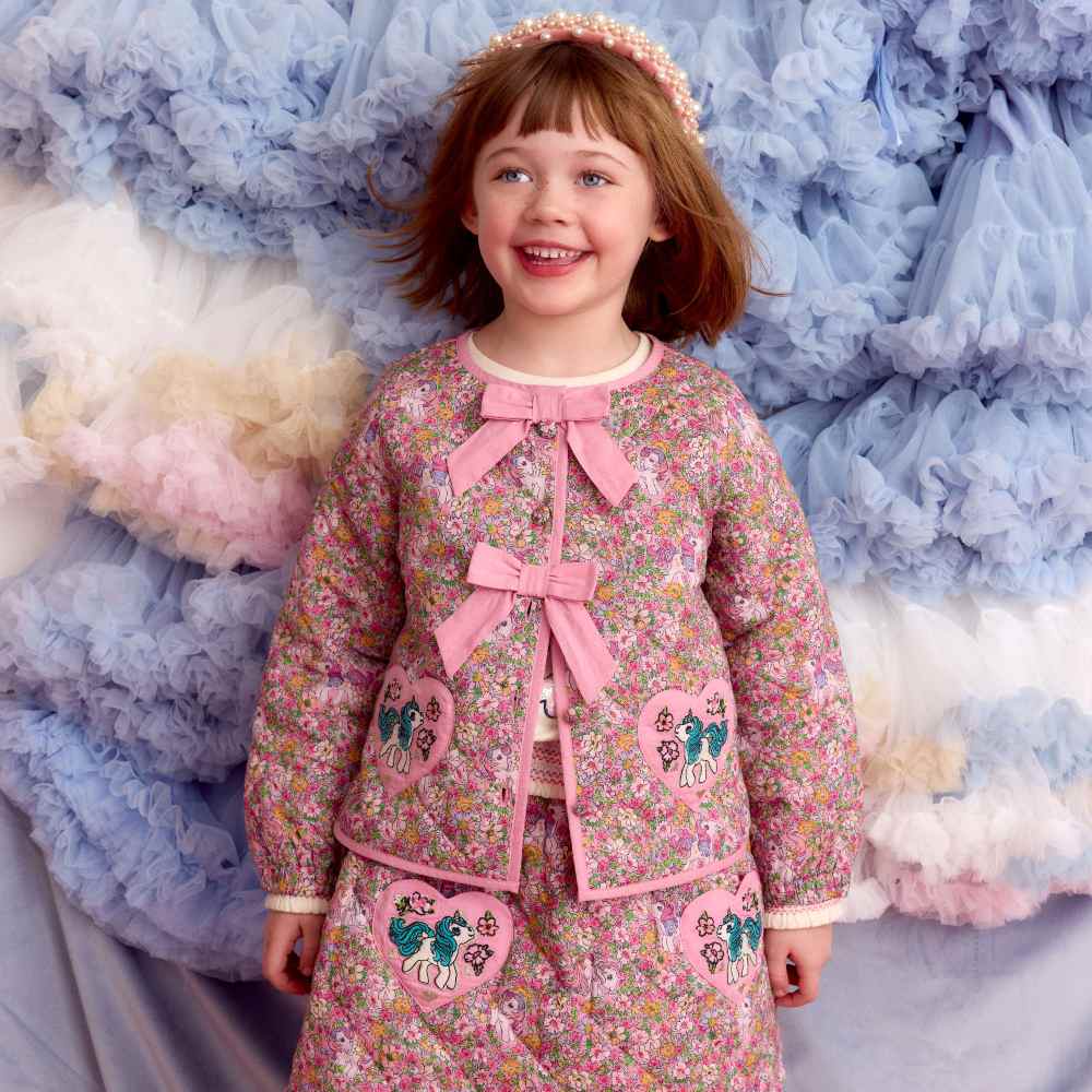 A girl wearing a dress from the My Little Pony by Monsoon collection 