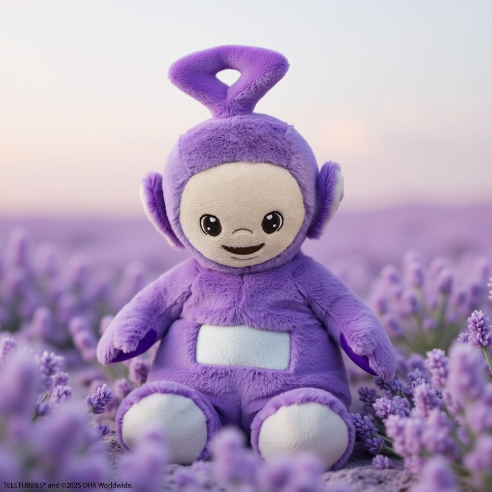 A purple Teletubbies toy by Warmies displayed in a field of lavender