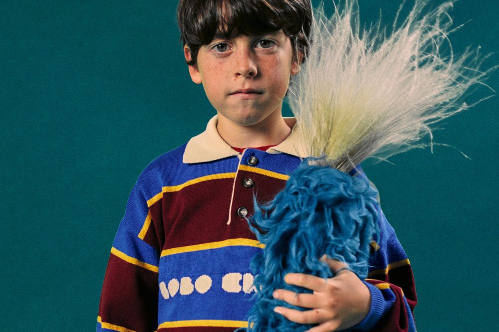 A boy in a striped knitted jumper