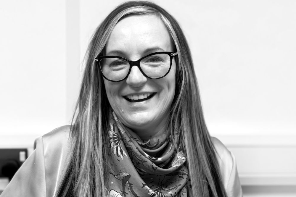 Black and white headshot of Lesley Beach, Group Managing Director of Grimsby-based baby and children’s swimwear brand