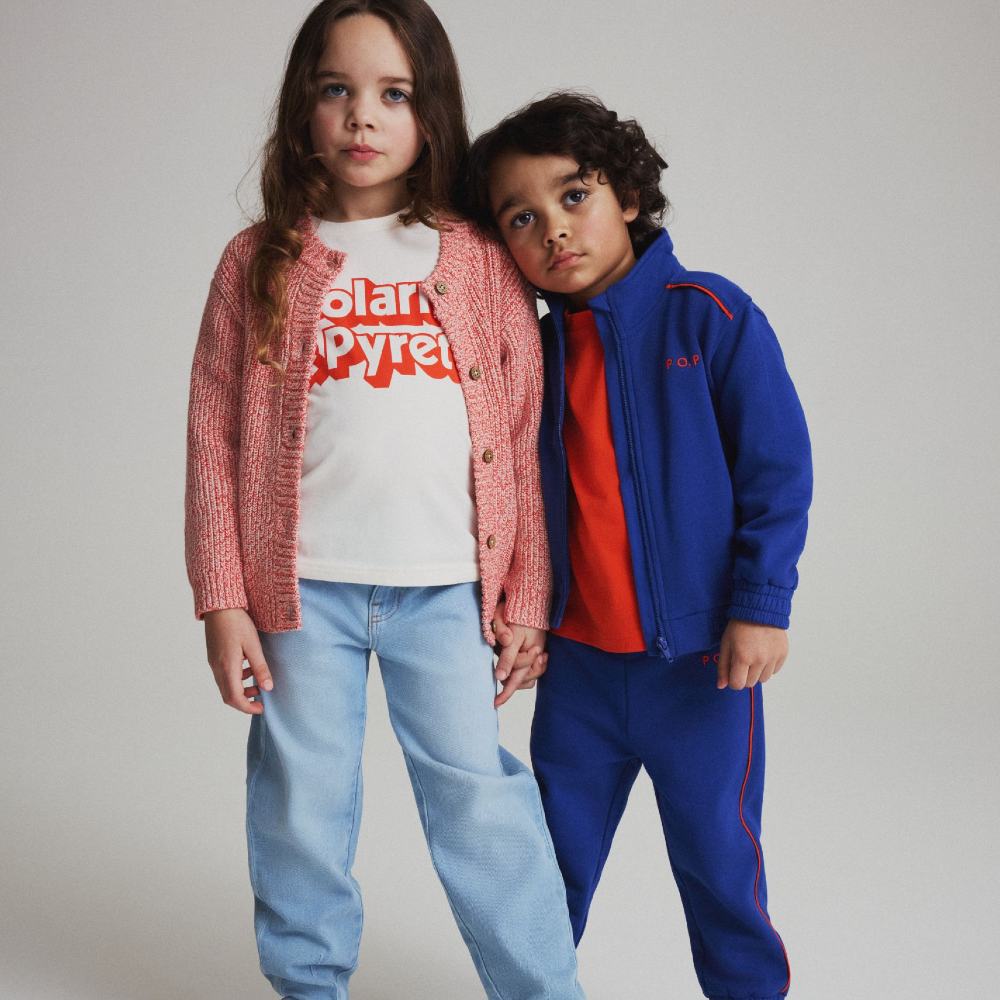 Two children wearing outfits from PO.P's 50th anniversary collection 