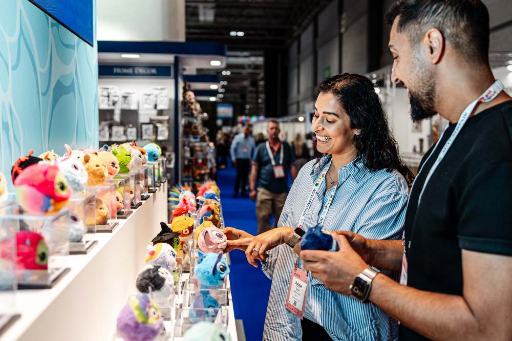 People looking at toys on a stand at Autumn Fair 
