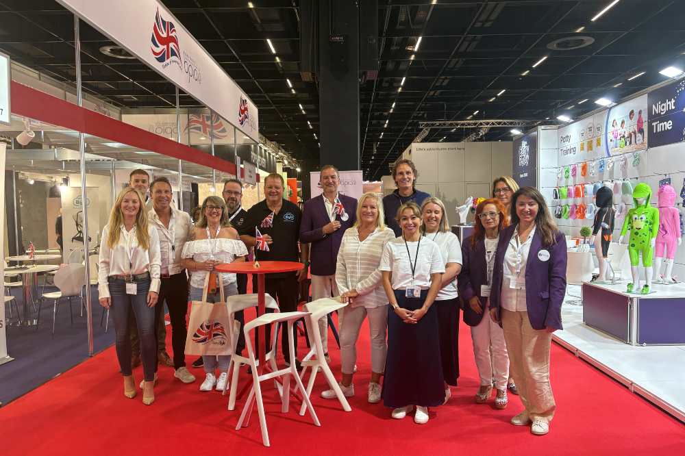 A group of people stood on the BPIA UK Pavilion at Kind + Jugend