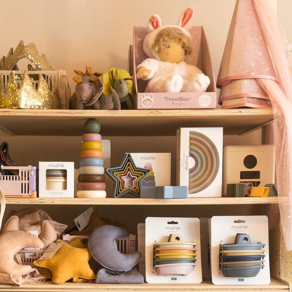 Children's toys and gifts displayed on shelves in a shop 