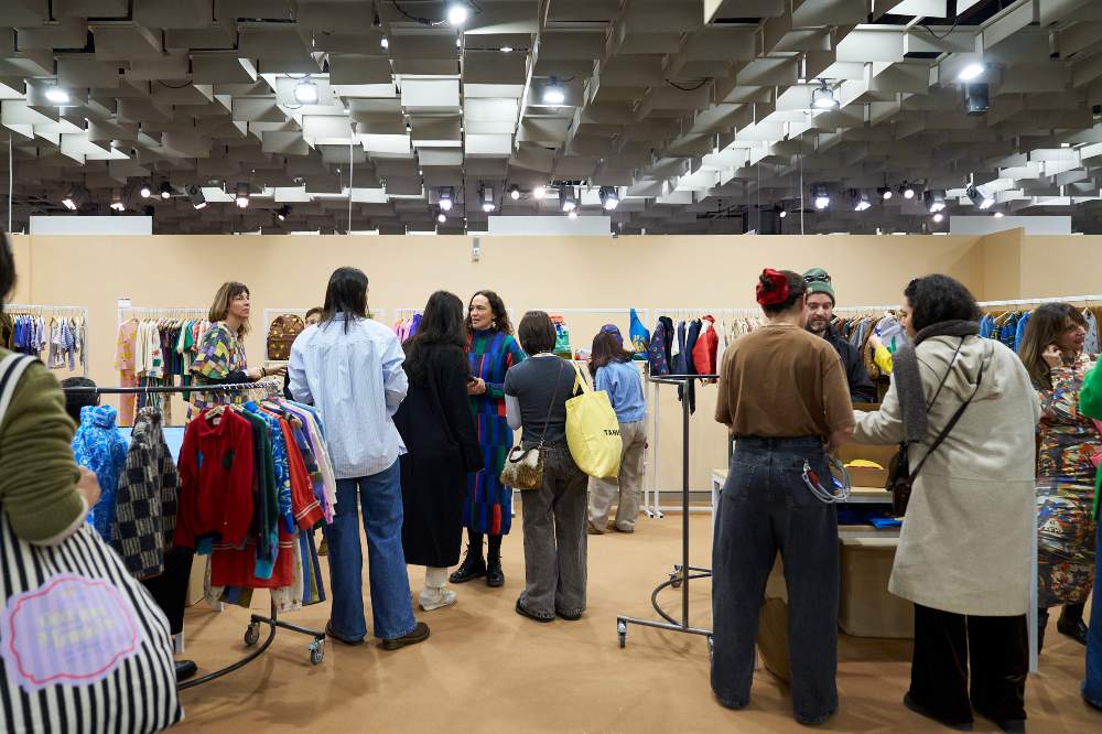 People stood on stands at Pitti Bimbo