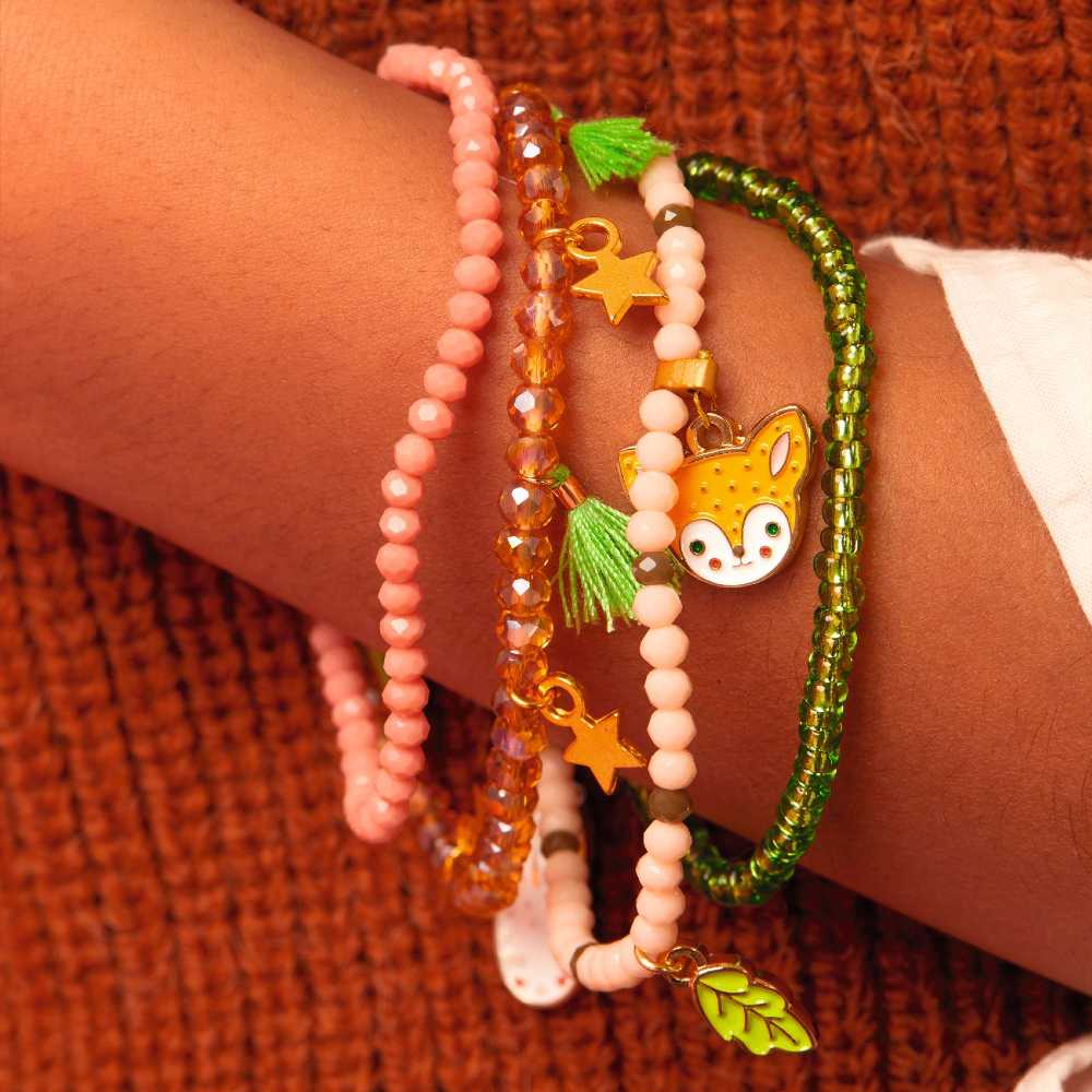 Children's forst themed bracelets by Plume shown on a child's wrist 