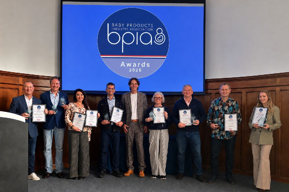 A group of people stood on a stage in front of a screen promoting the BPIA Awards 2026