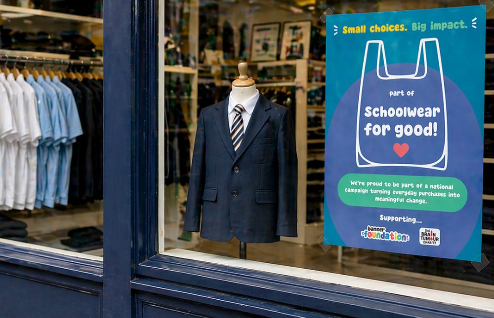 A window of a school uniform shop advertising Banner's Schoolwear for Good campaign