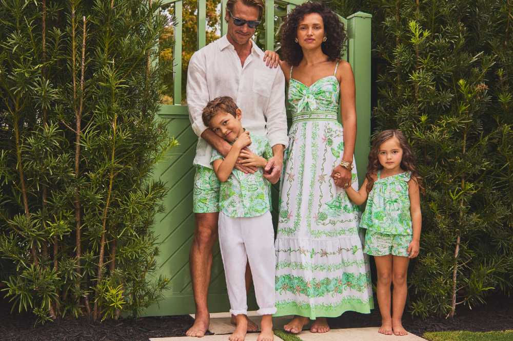 A family stood outside wearing coordinating outfits from the Lilly Pulitzer x Janie and Jack collaboration
