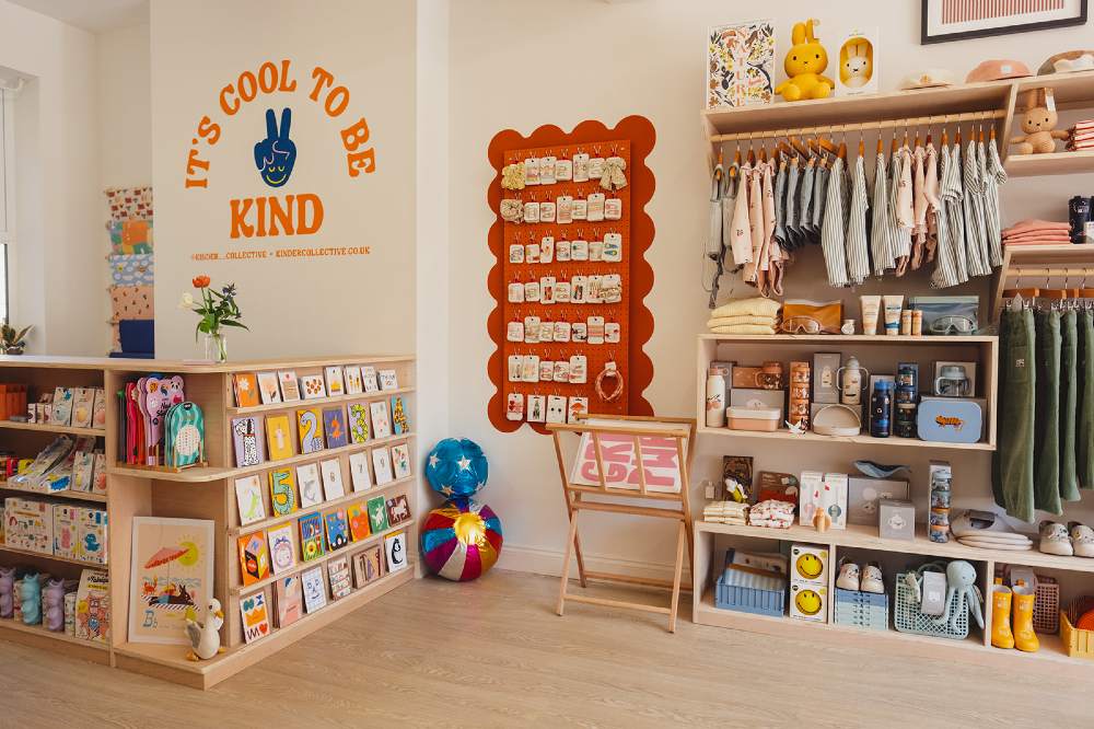 Children's clothing and product shown inside the Kinder Collective store