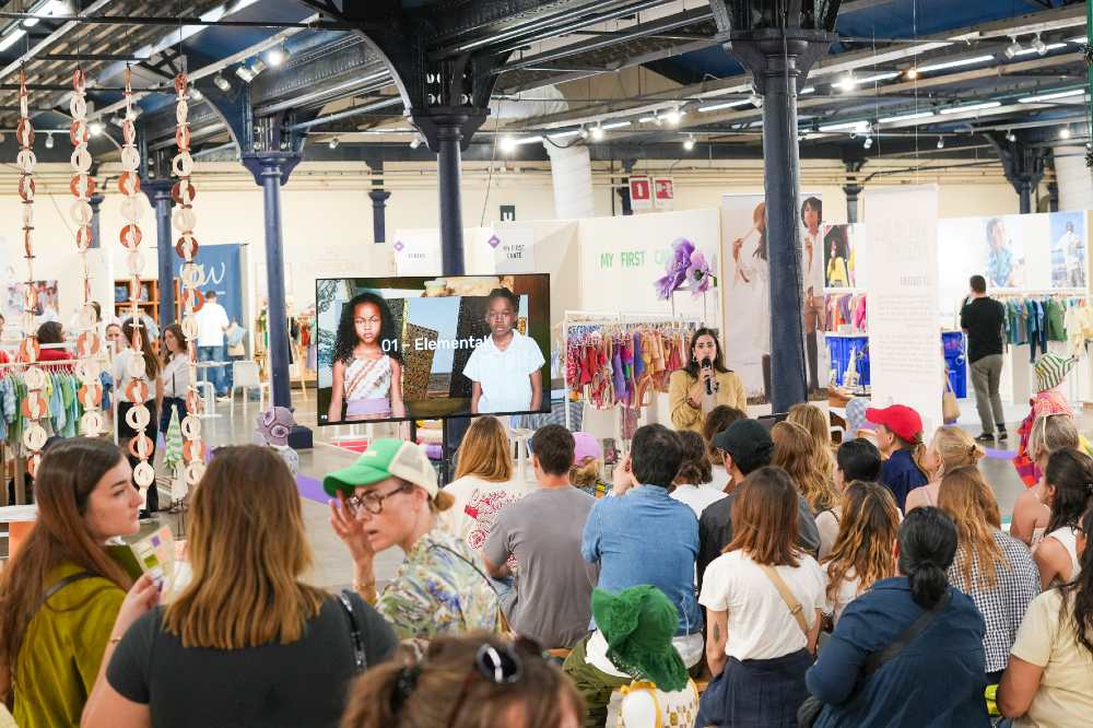 People sat watching a presentation at the Playtime trade show 