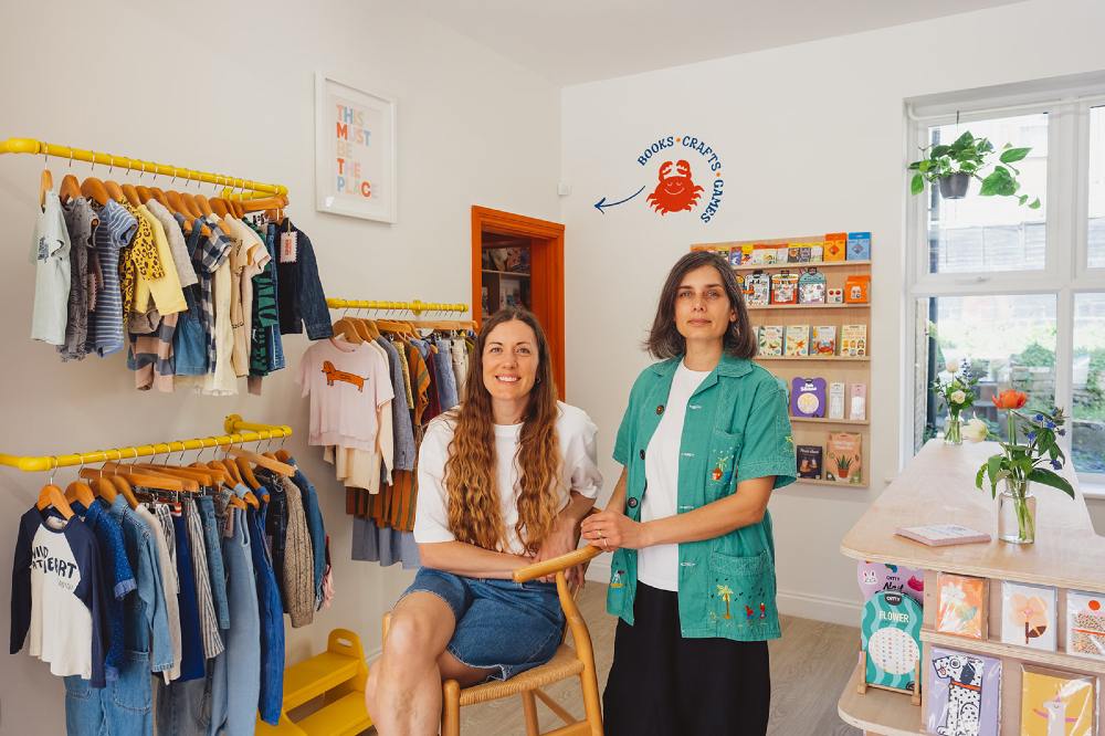 The owners of children's shop Kinder Collective stood in the store