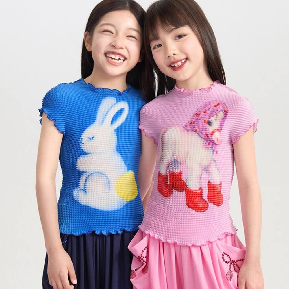 Two girls wearing bright graphic print T-shirts