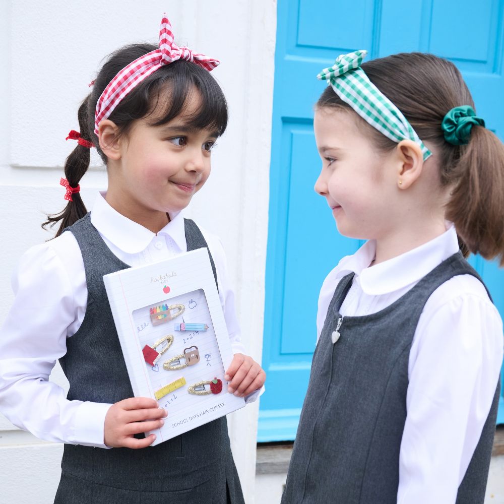 Two girls in school uniform wearing hair accessories from the Rockahula Kids Back to School collection