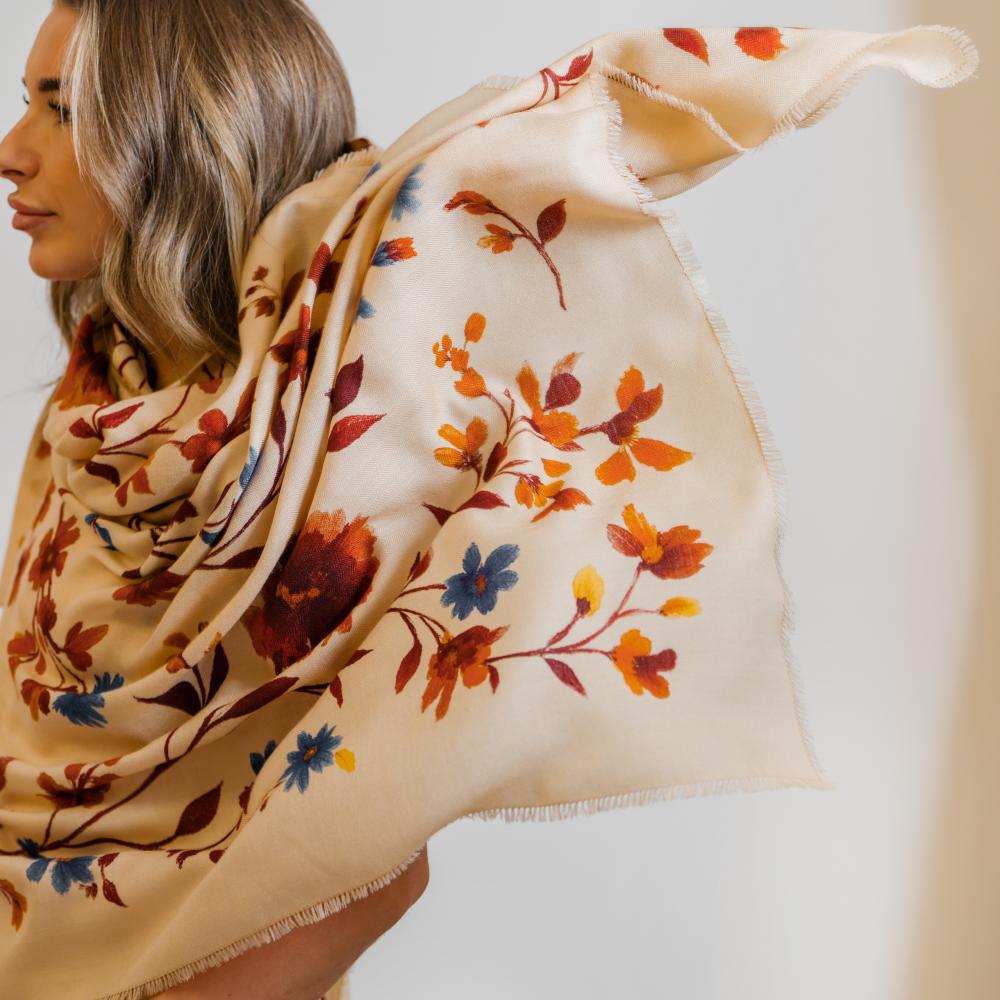 A woman wearing a nursing cover with flower pattern
