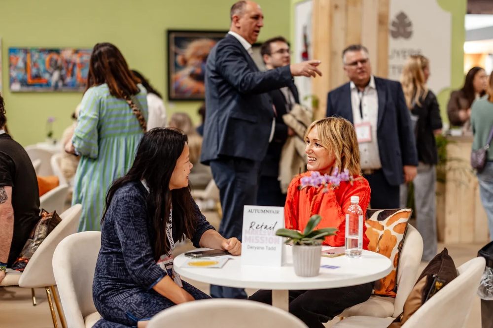 People sat at a table at Autumn Fair for a 1-2-1 Mentor Session