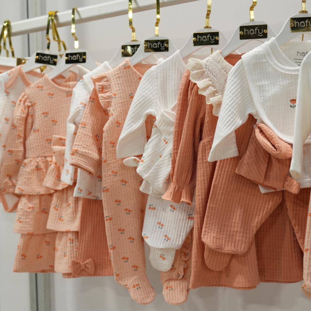 Baby clothes displayed on a rail at IFCO Kids 