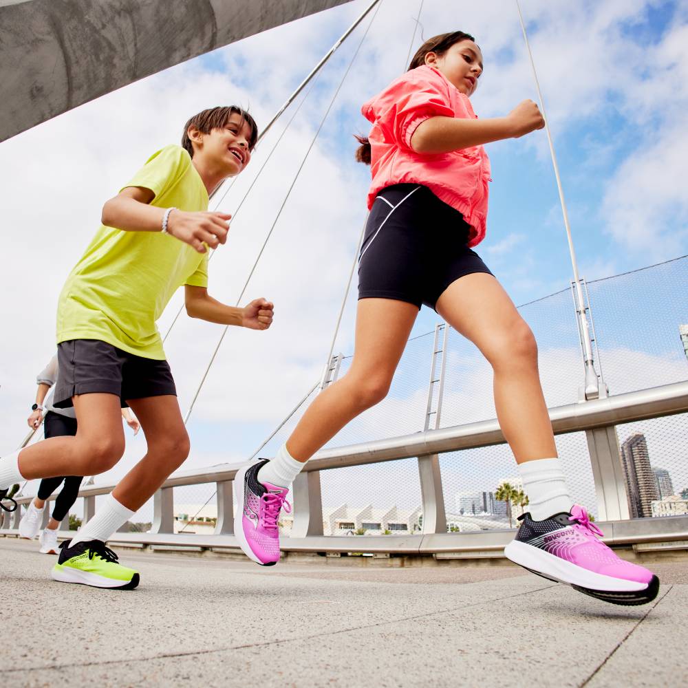 Children running outside in shorts and T-shirts 