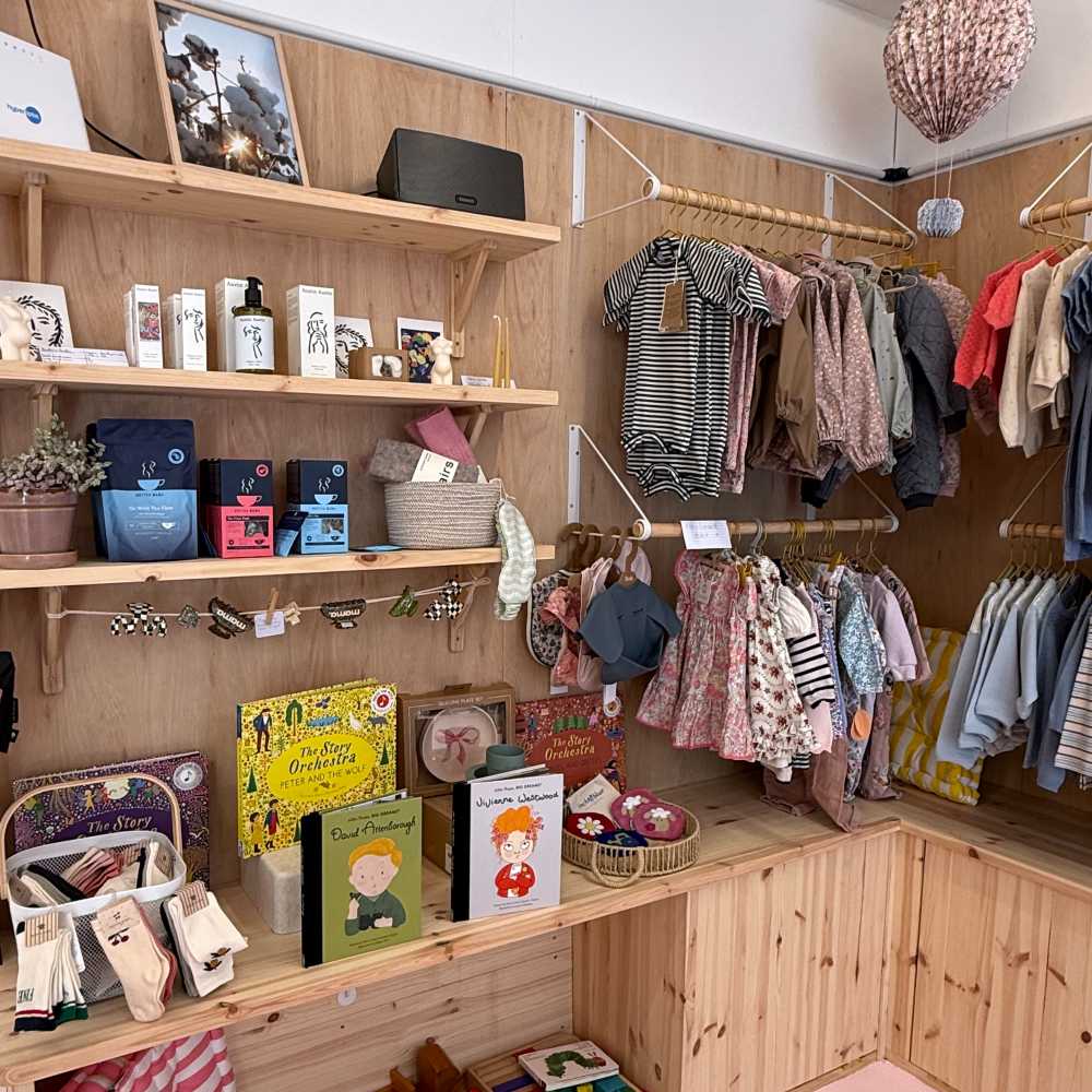 Children's clothes and products displayed in the Inti Baby store 