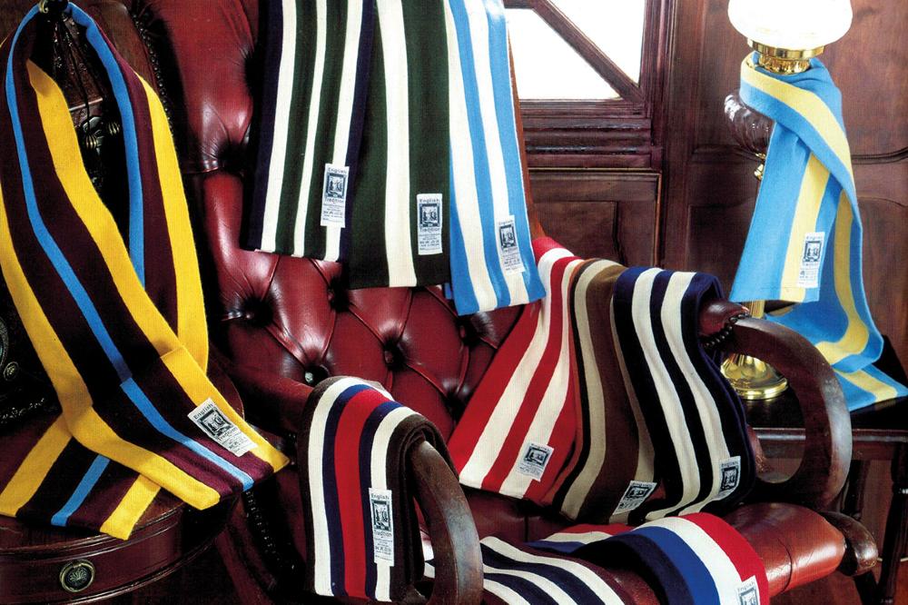 School scarves by Tie & Scarf Company displayed on a chair
